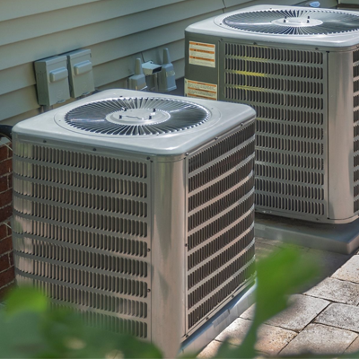 HVAC technician servicing home heating and cooling system